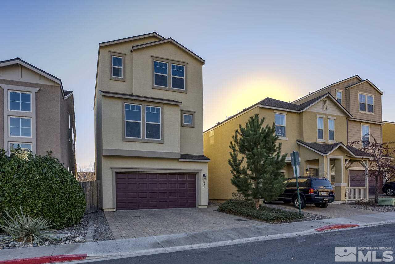 5970 Promontory Drive Reno, NV 89523 - Photo 1 of 19 a front view of a house with a yard and garage