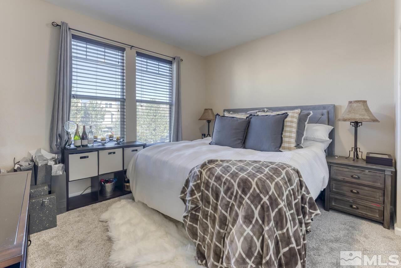 5970 Promontory Drive Reno, NV 89523 - Photo 8 of 19 a bedroom with a bed and a window