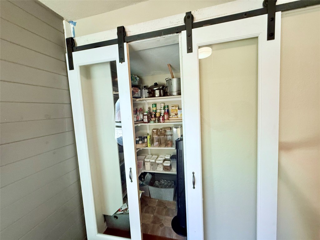 6027 Bluebell Circle Austin, TX 78741 - Photo 19 of 26 a bathroom with a glass shower door