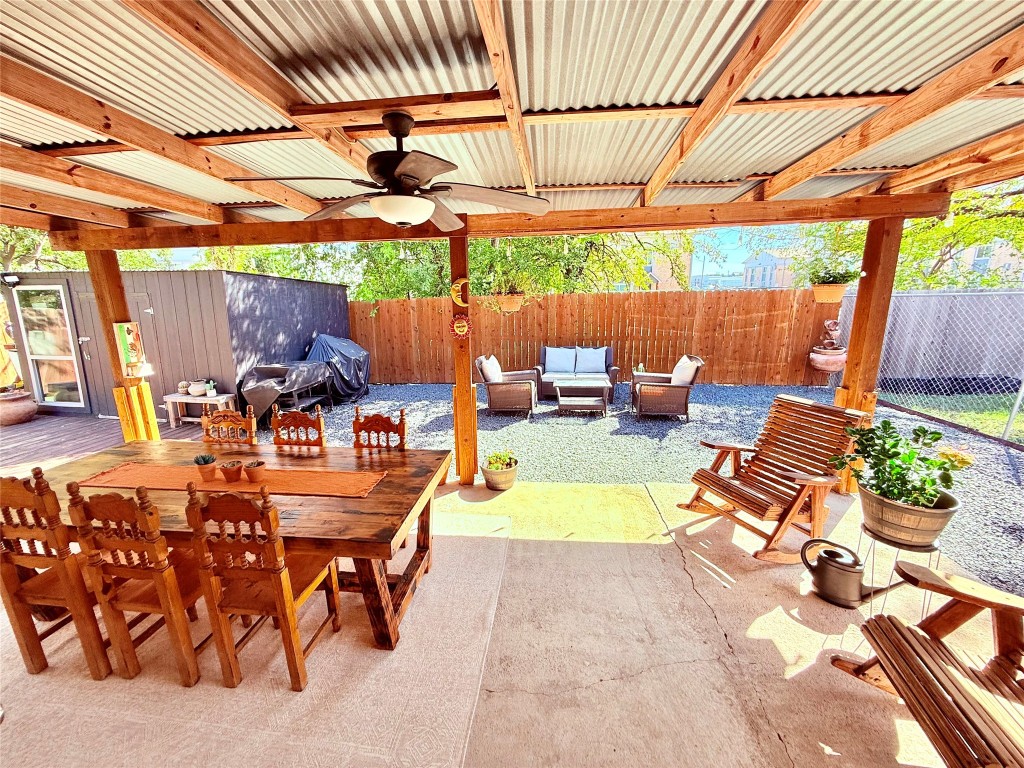 6027 Bluebell Circle Austin, TX 78741 - Photo 20 of 26 a view of a patio with a table and chairs under an umbrella