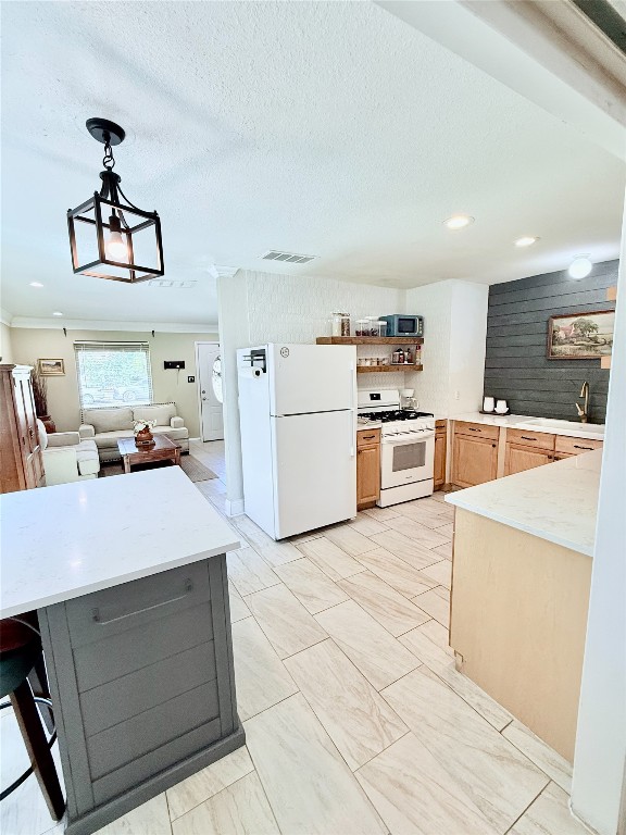 6027 Bluebell Circle Austin, TX 78741 - Photo 4 of 26 a kitchen with kitchen island a sink counter top space and stainless steel appliances