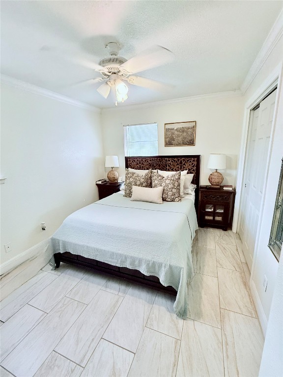 6027 Bluebell Circle Austin, TX 78741 - Photo 9 of 26 a bedroom with a bed and a chandelier