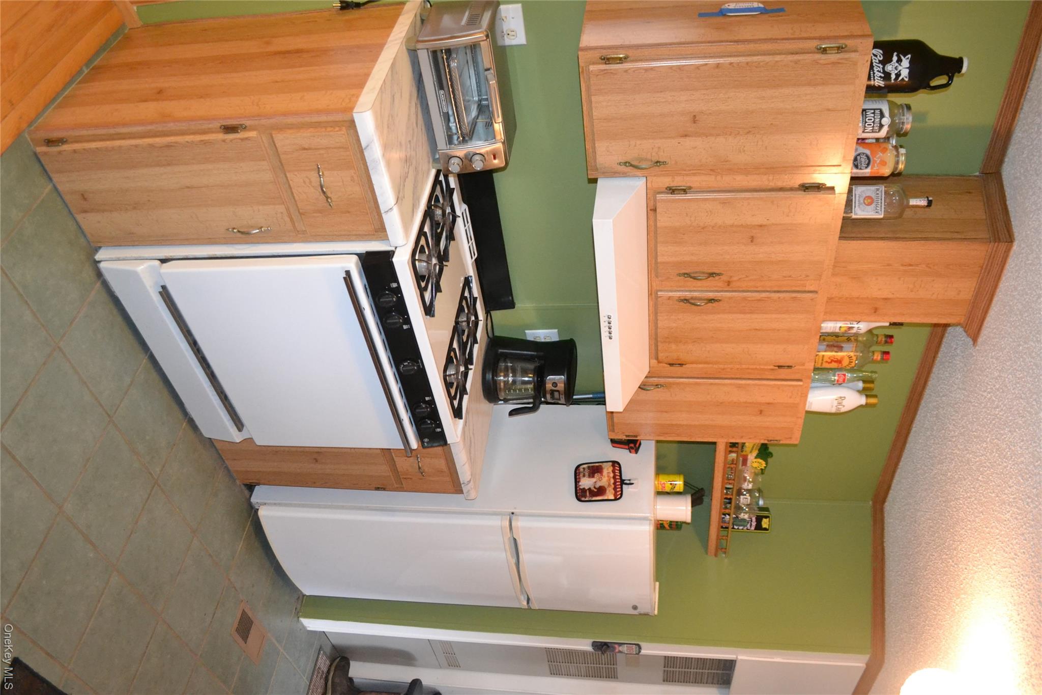 144 Bonnie Brook Road Roscoe, NY 12776 - Photo 12 of 34 a kitchen with a stove and a refrigerator