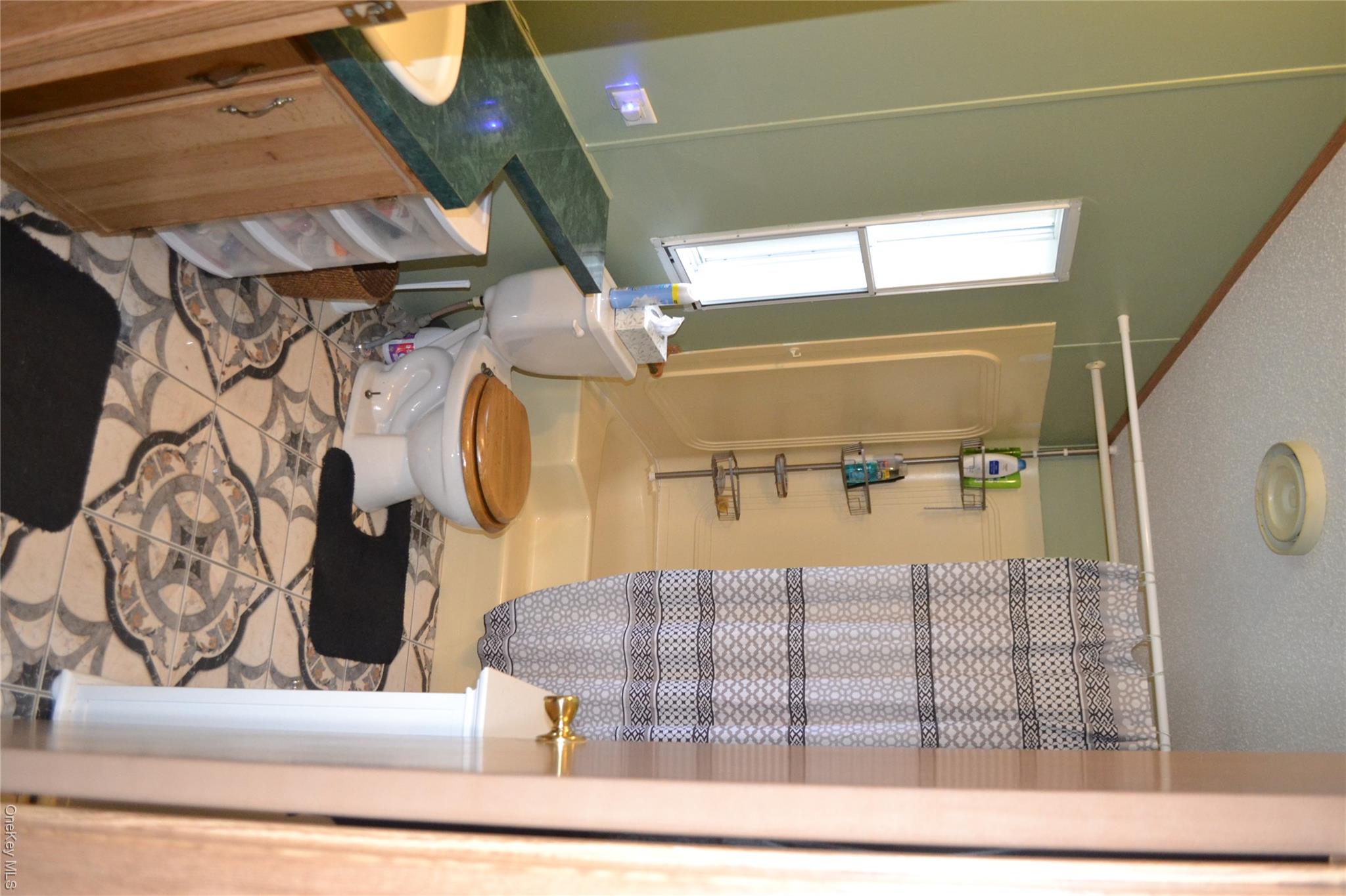 144 Bonnie Brook Road Roscoe, NY 12776 - Photo 14 of 34 a bathroom with a sink toilet and shower