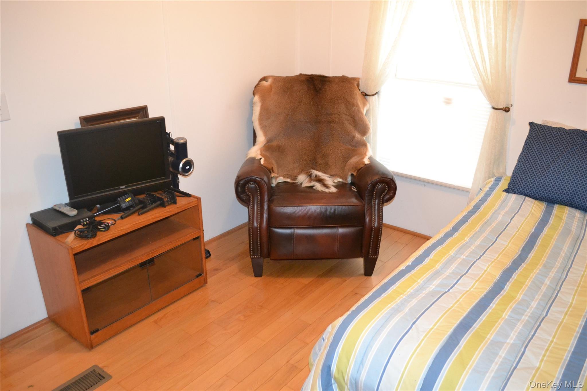 144 Bonnie Brook Road Roscoe, NY 12776 - Photo 17 of 34 a bedroom with furniture and a bed