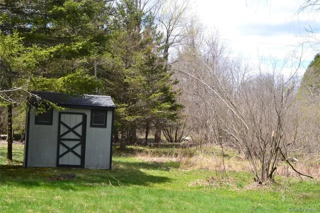 a view of a park with large trees