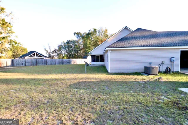 a view of a house with a yard and swimming pool