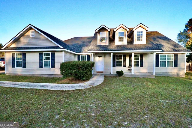 a front view of a house with a yard