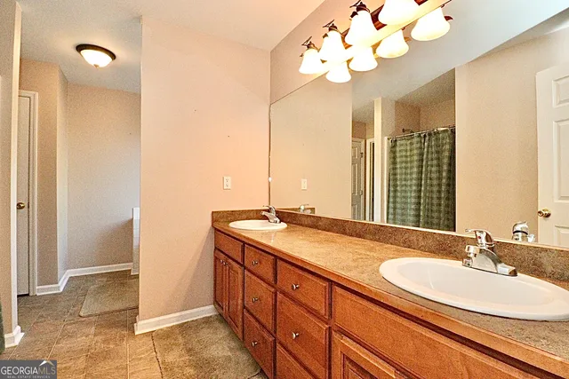 a bathroom with a sink vanity and a mirror