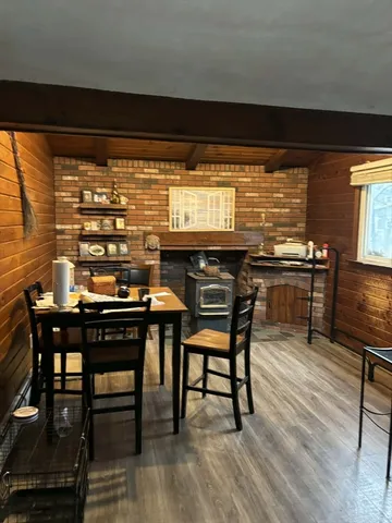 a kitchen with a table and chairs in it