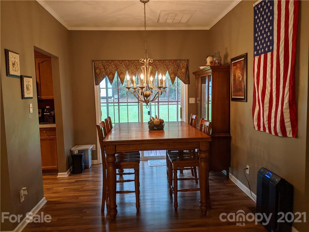 162 Robinson Creek Road Bostic, NC 28018 - Photo 14 of 35 a view of a dining room with furniture window and wooden floor