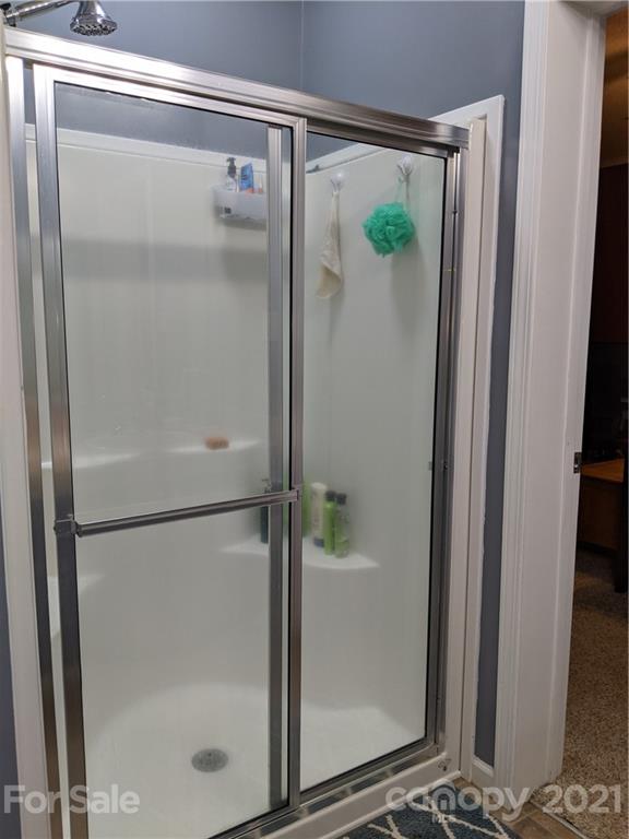 162 Robinson Creek Road Bostic, NC 28018 - Photo 18 of 35 a bathroom with a glass shower door