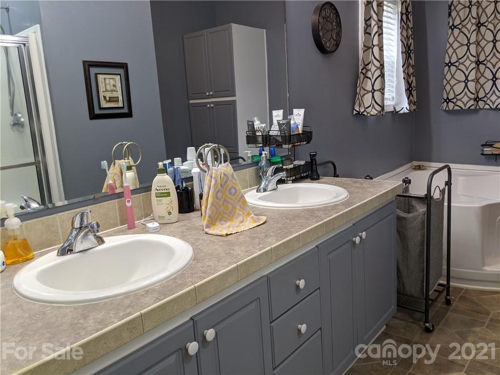 162 Robinson Creek Road Bostic, NC 28018 - Photo 19 of 35 a bathroom with a sink and a mirror
