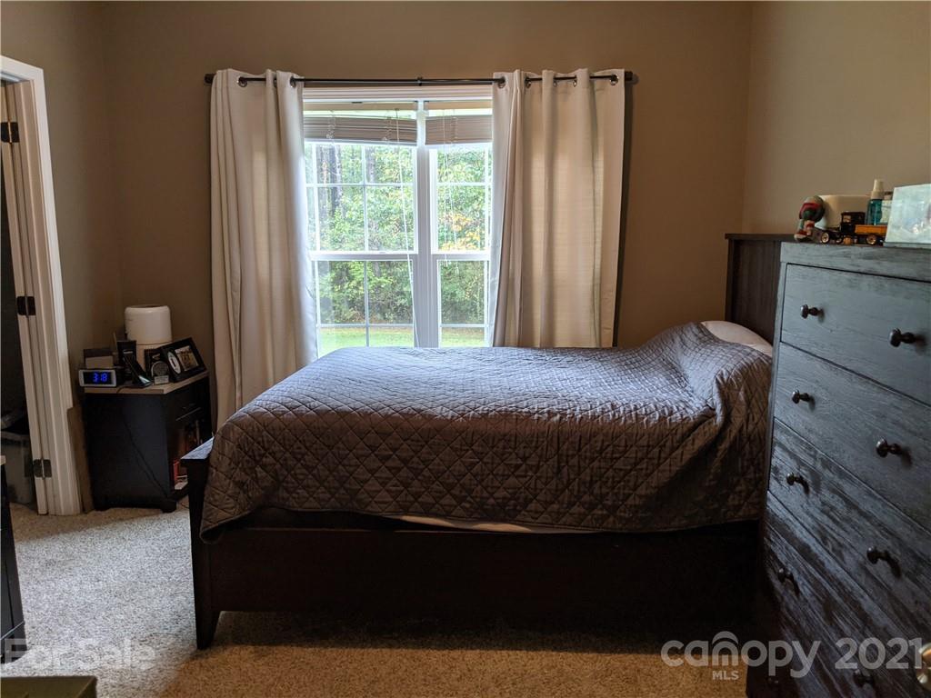 162 Robinson Creek Road Bostic, NC 28018 - Photo 20 of 35 a bedroom with a bed and a window