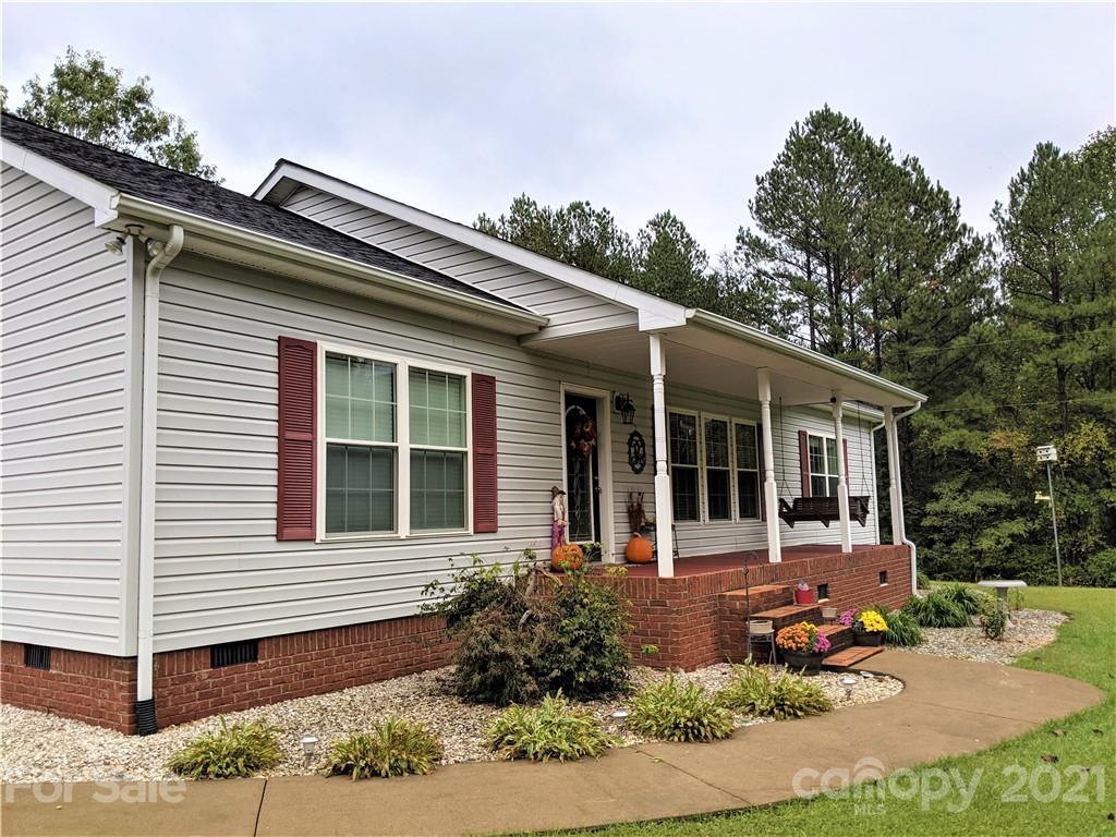 162 Robinson Creek Road Bostic, NC 28018 - Photo 3 of 35 a front view of a house with garden