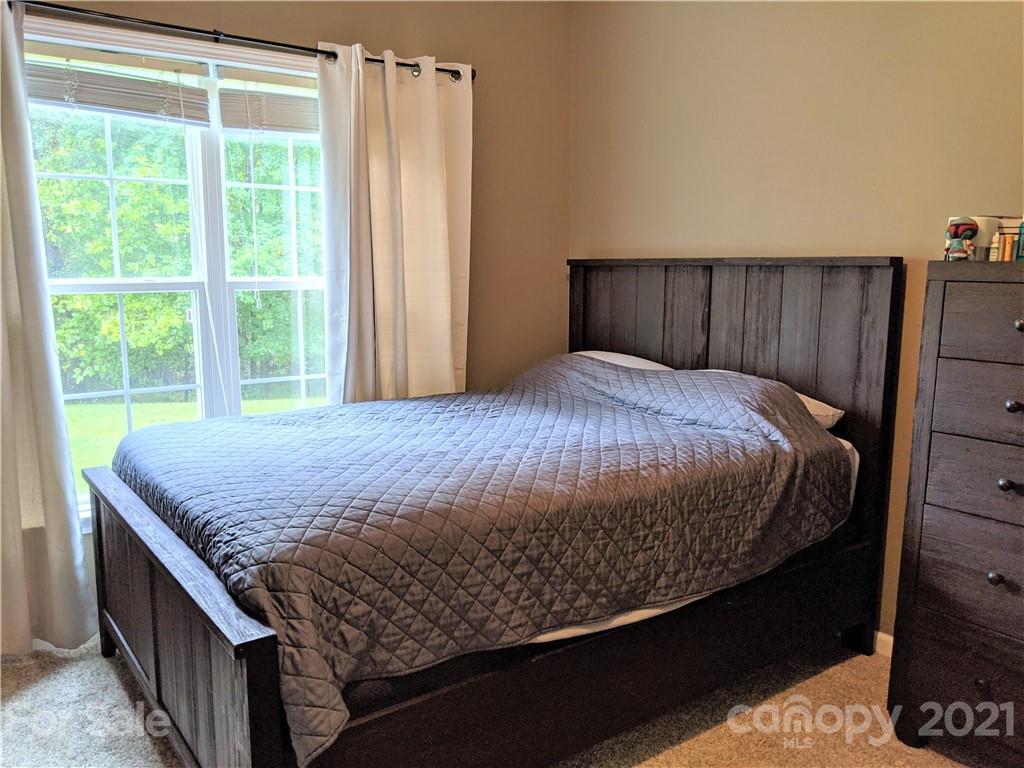 162 Robinson Creek Road Bostic, NC 28018 - Photo 21 of 35 a bed sitting in a bedroom next to a window