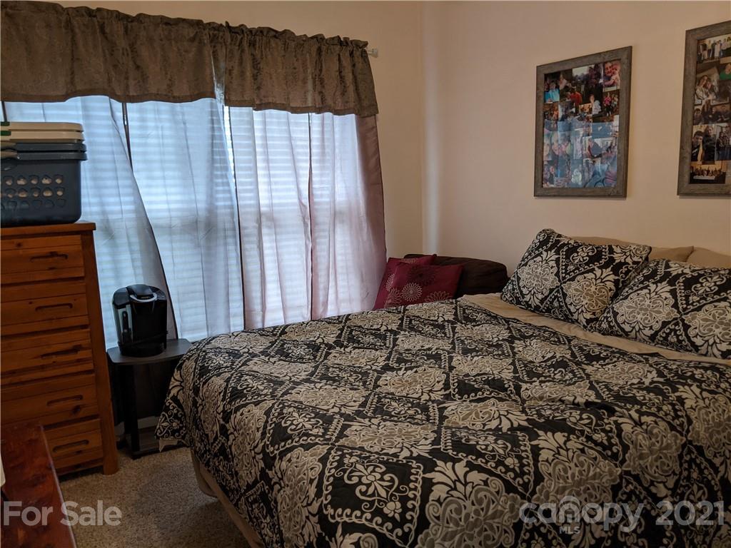 162 Robinson Creek Road Bostic, NC 28018 - Photo 23 of 35 a bedroom with a bed and a window