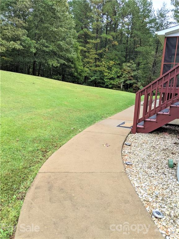 162 Robinson Creek Road Bostic, NC 28018 - Photo 24 of 35 a view of a yard with a wooden fence