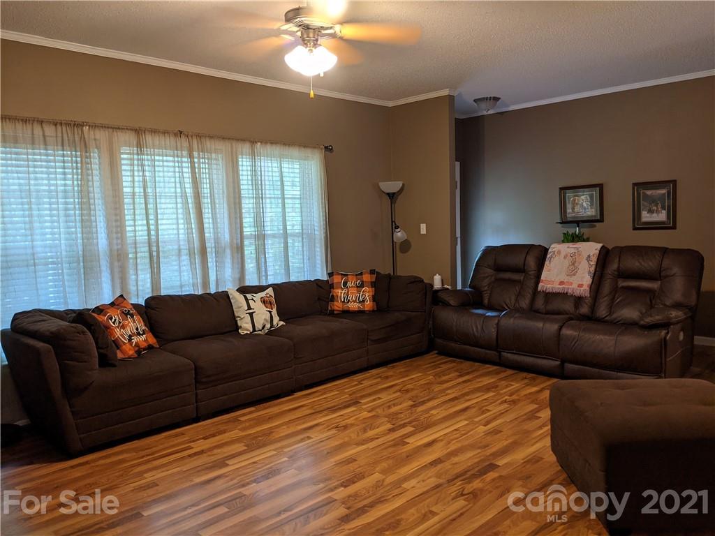 162 Robinson Creek Road Bostic, NC 28018 - Photo 4 of 35 a living room with furniture and a lamp