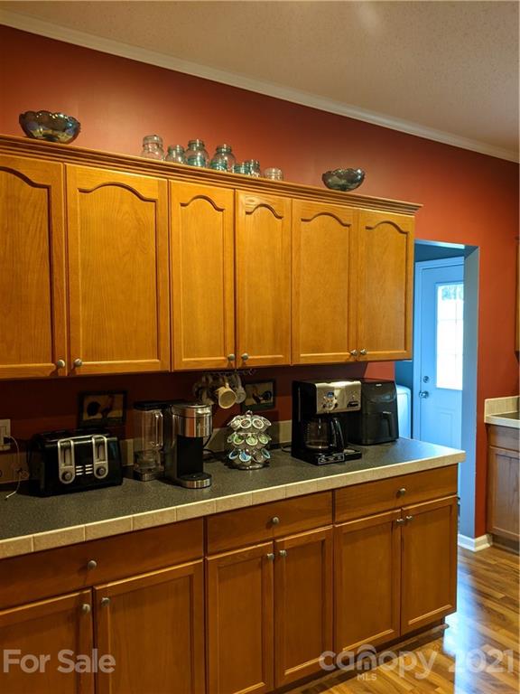 162 Robinson Creek Road Bostic, NC 28018 - Photo 7 of 35 a kitchen with sink and wooden cabinets