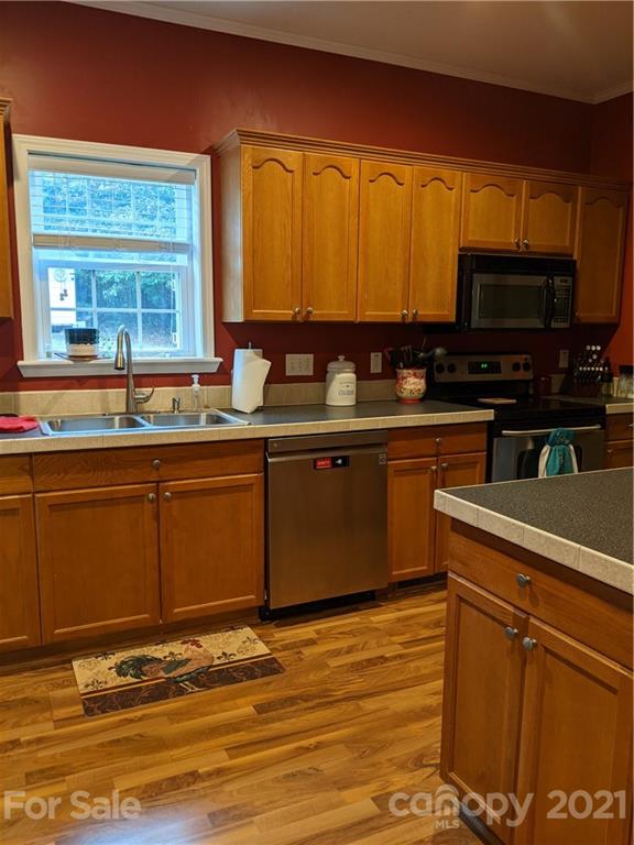 162 Robinson Creek Road Bostic, NC 28018 - Photo 8 of 35 a kitchen with stainless steel appliances granite countertop a sink and cabinets