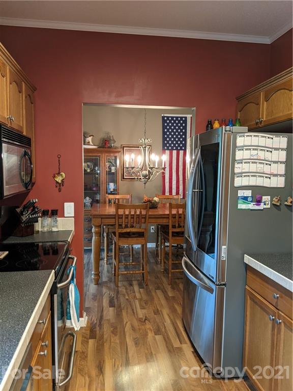 162 Robinson Creek Road Bostic, NC 28018 - Photo 9 of 35 a kitchen with stainless steel appliances granite countertop a stove refrigerator and a dining table