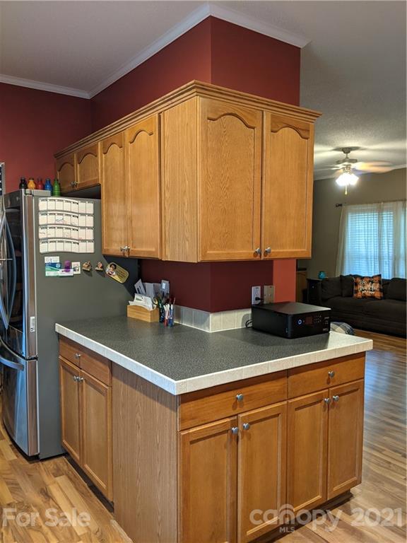 162 Robinson Creek Road Bostic, NC 28018 - Photo 10 of 35 a kitchen with stainless steel appliances granite countertop a sink a stove cabinets and living room view