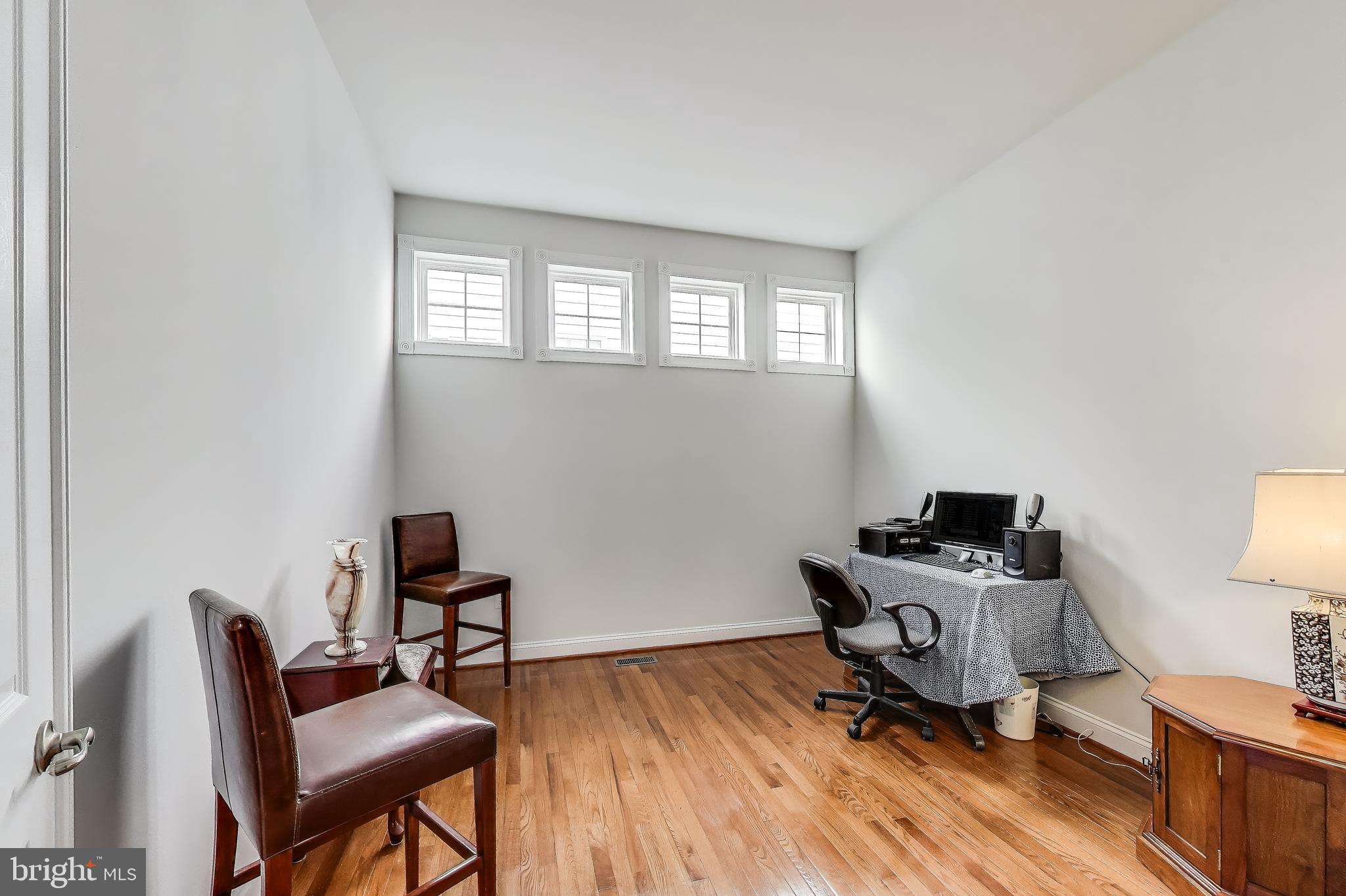 16180 Radburn Street Woodbridge, VA 22191 - Photo 16 of 54 a room with furniture and a window