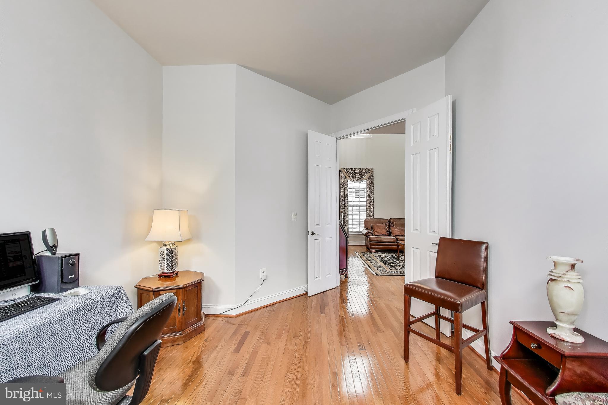 16180 Radburn Street Woodbridge, VA 22191 - Photo 17 of 54 a bedroom with furniture and a wooden floor
