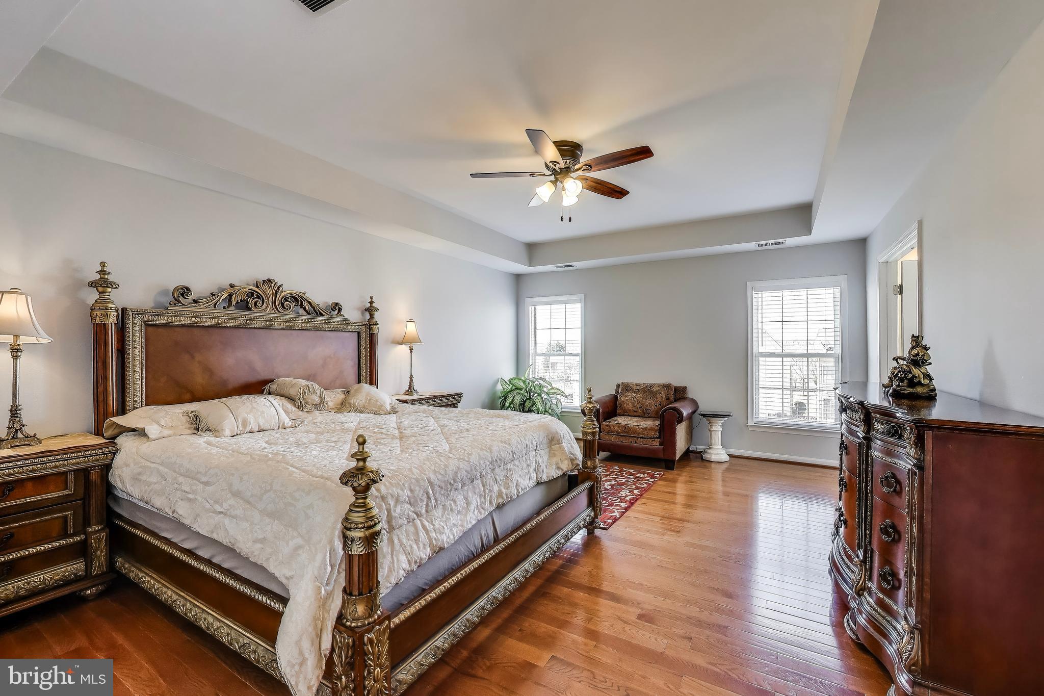 16180 Radburn Street Woodbridge, VA 22191 - Photo 22 of 54 a bedroom with a bed and wooden floor