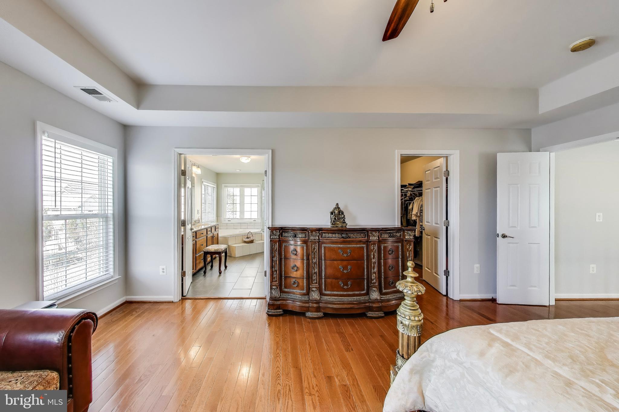 16180 Radburn Street Woodbridge, VA 22191 - Photo 24 of 54 a bed room with a bed and a chair
