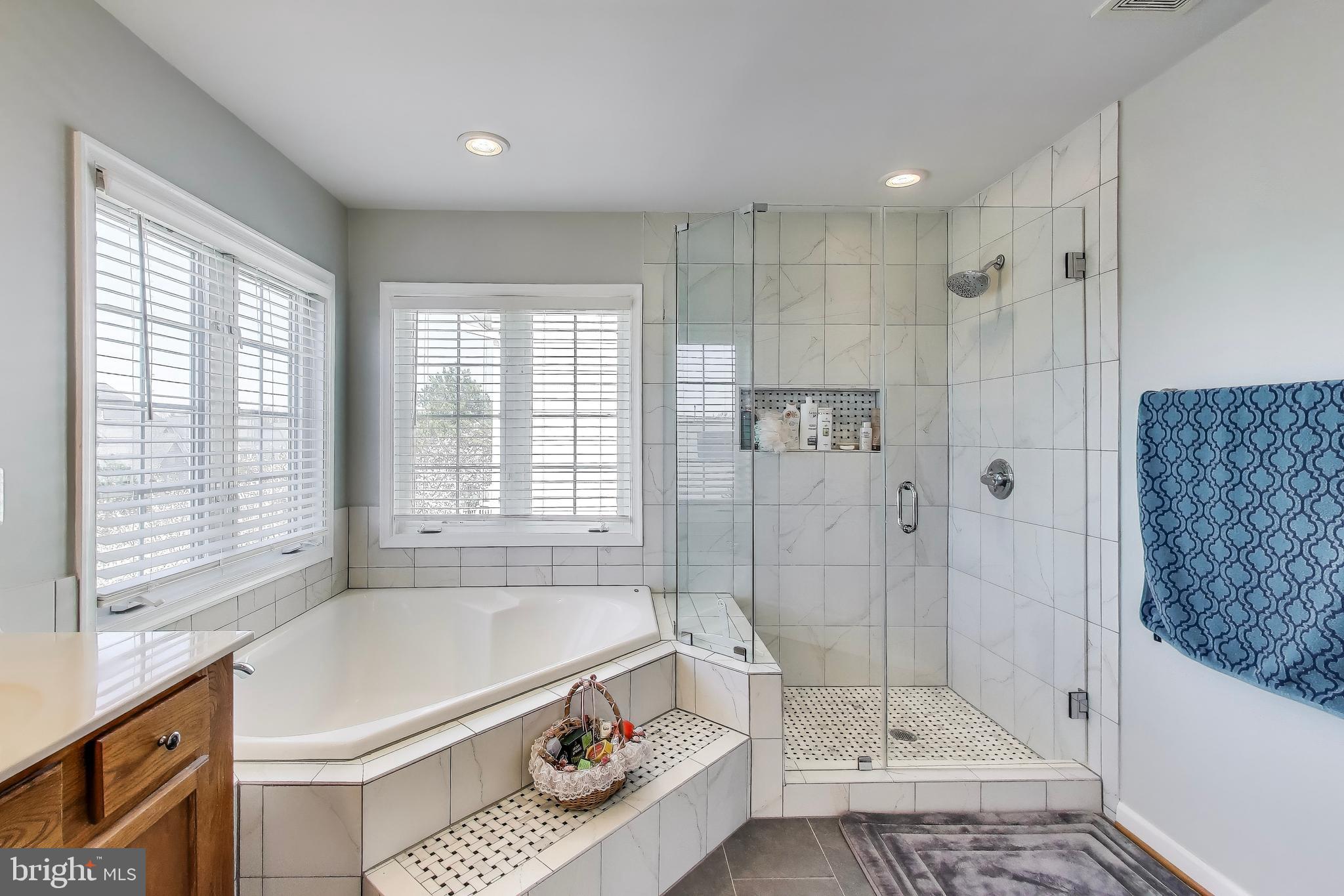 16180 Radburn Street Woodbridge, VA 22191 - Photo 27 of 54 a bathroom with a tub shower and sink