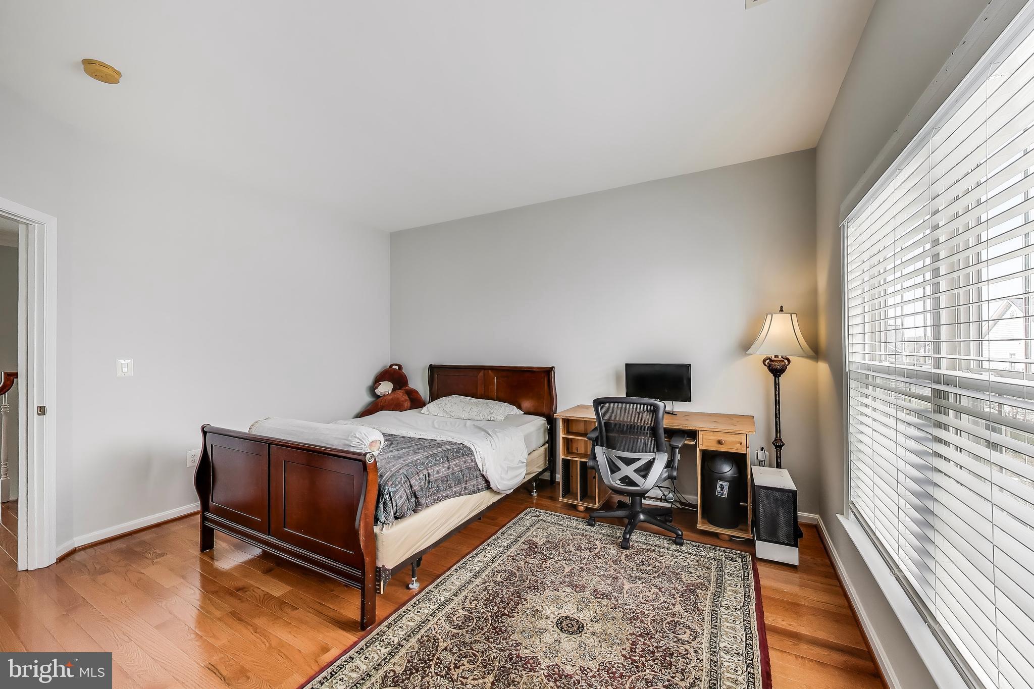 16180 Radburn Street Woodbridge, VA 22191 - Photo 29 of 54 a bed room with a bed and a window