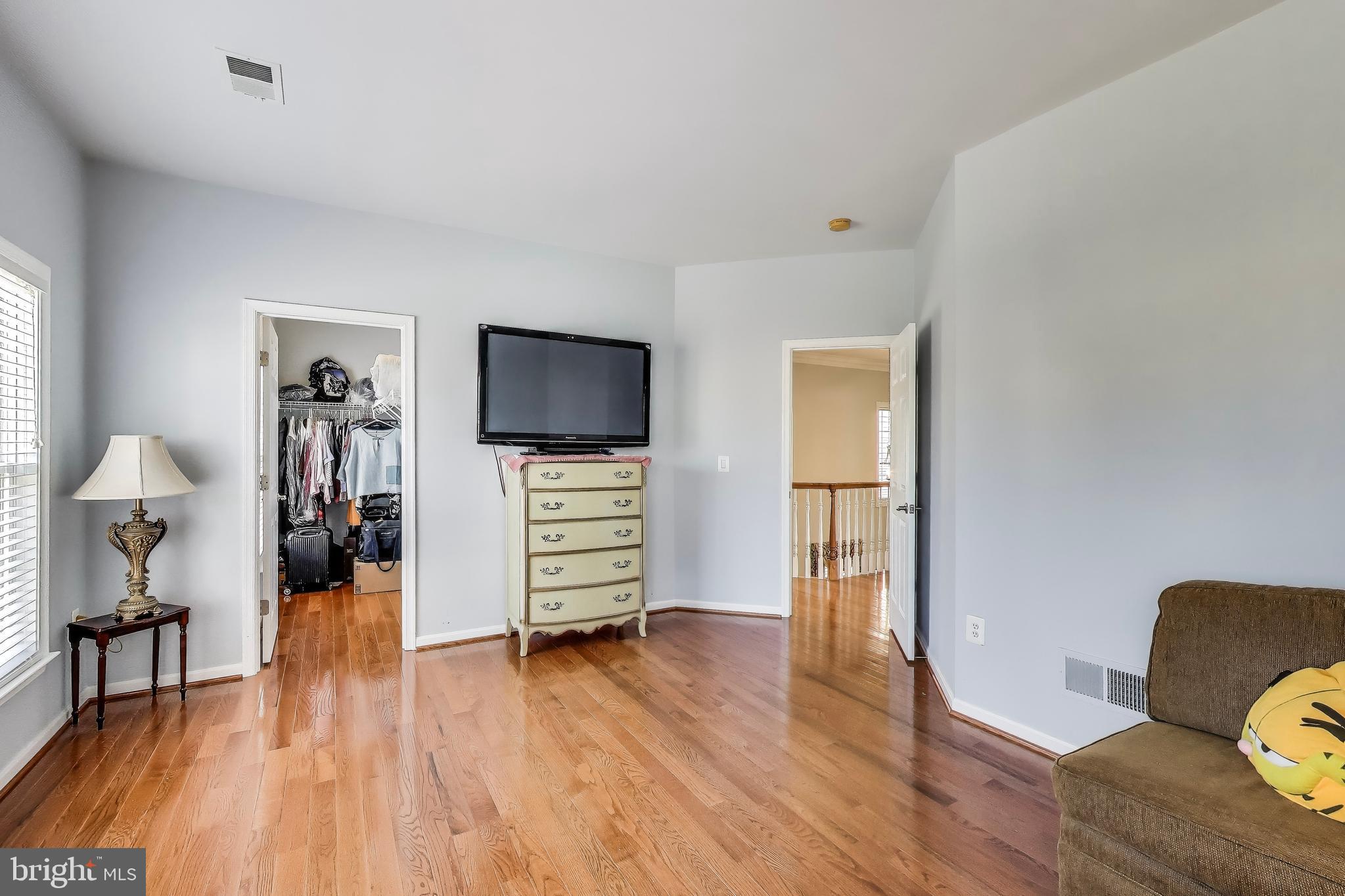 16180 Radburn Street Woodbridge, VA 22191 - Photo 38 of 54 a living room with furniture and a flat screen tv