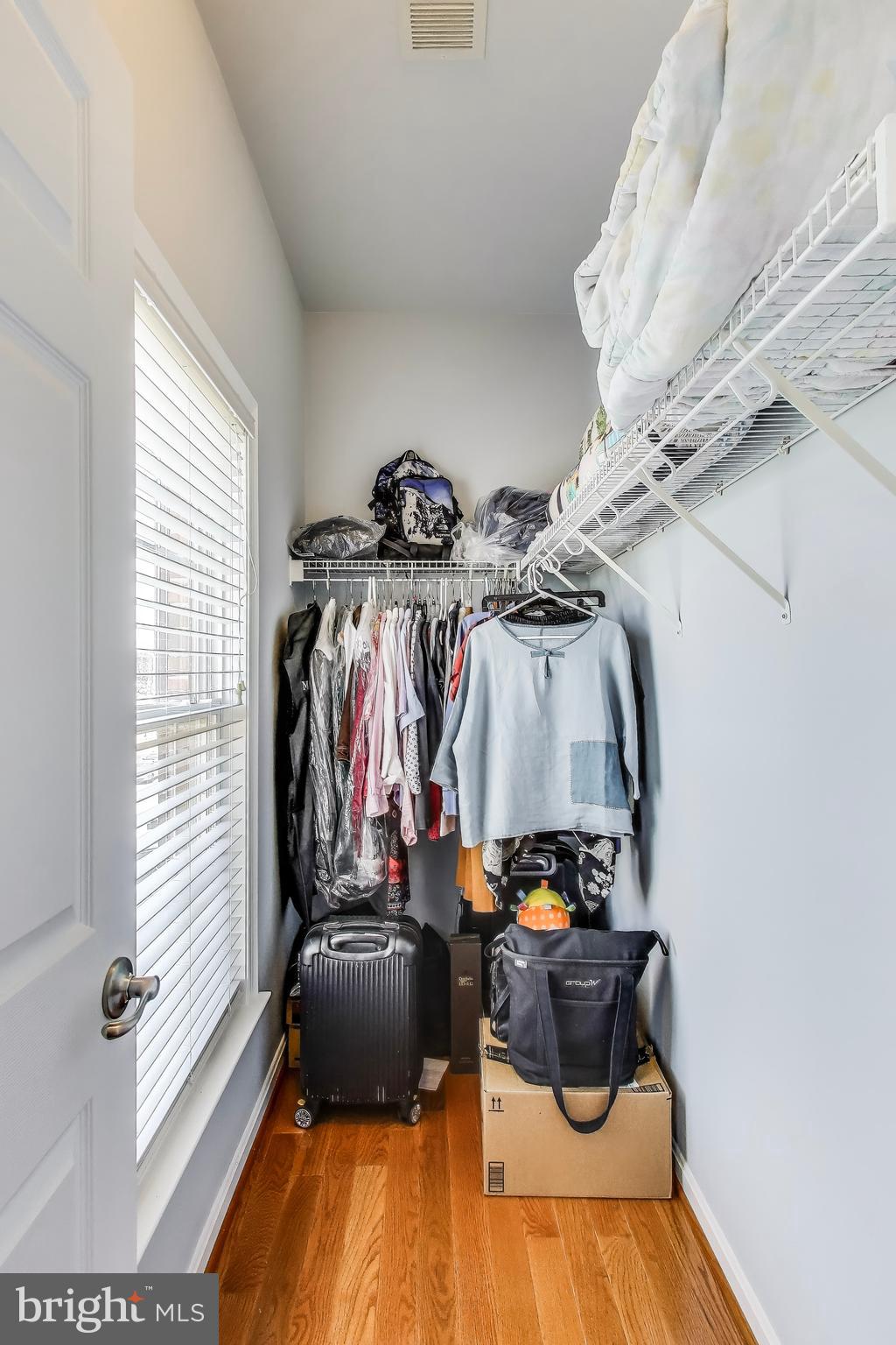 16180 Radburn Street Woodbridge, VA 22191 - Photo 39 of 54 a view of walk in closet with clothes and shoes