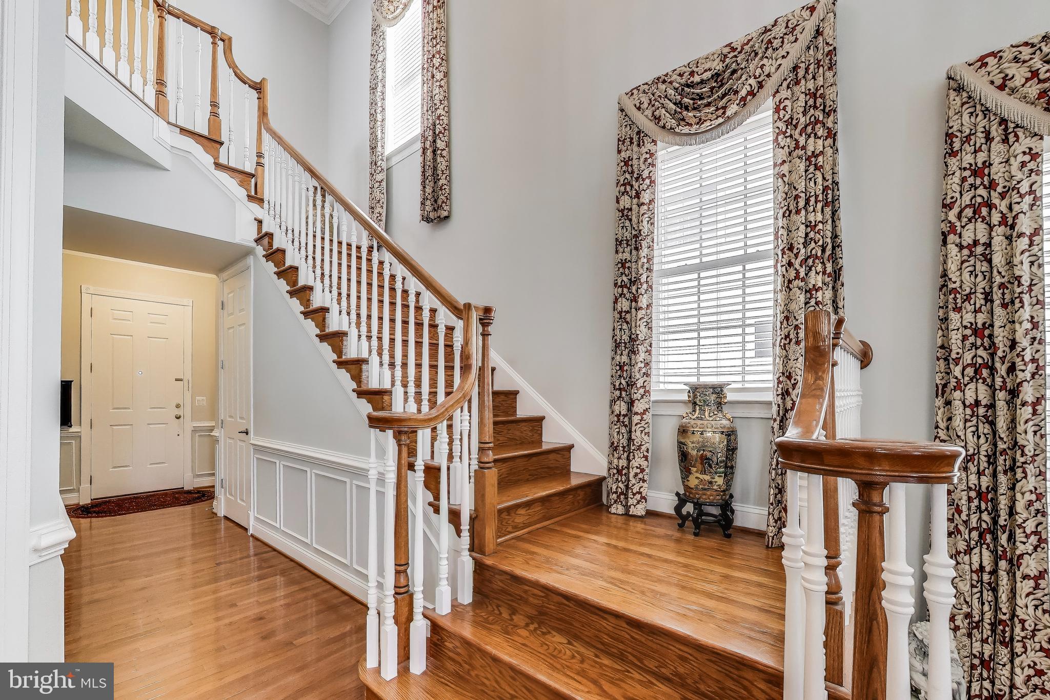 16180 Radburn Street Woodbridge, VA 22191 - Photo 4 of 54 a view of entryway and hall with wooden floor
