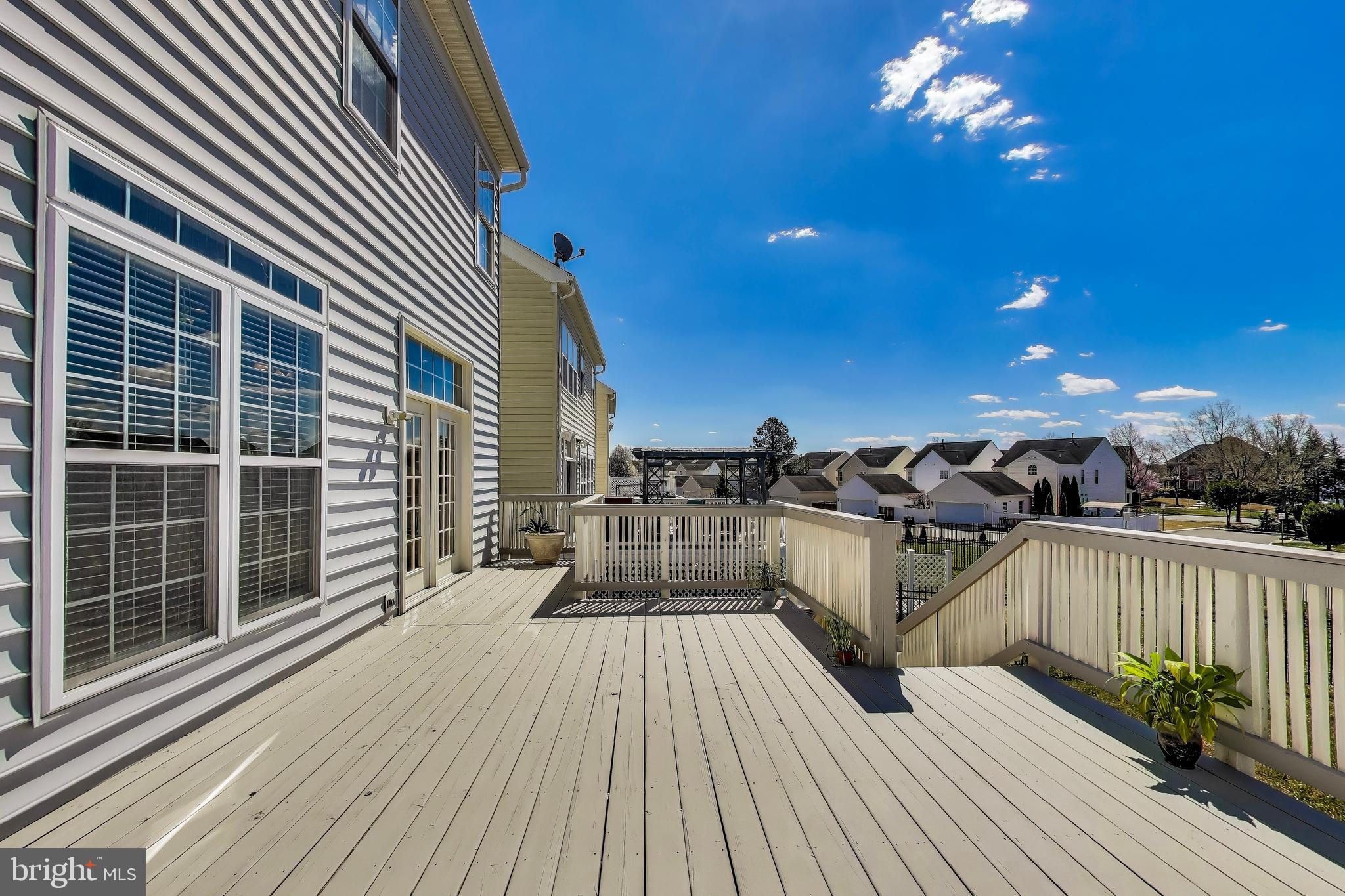 16180 Radburn Street Woodbridge, VA 22191 - Photo 45 of 54 a view of a balcony with dining table