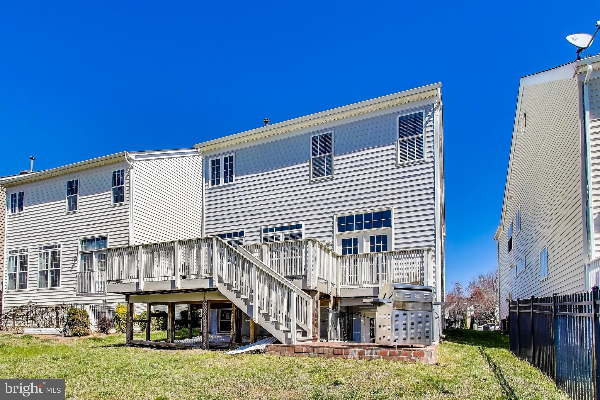 16180 Radburn Street Woodbridge, VA 22191 - Photo 48 of 54 a view of a house with roof deck