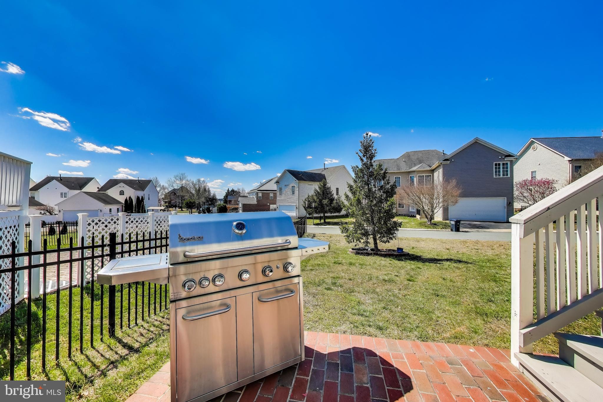 16180 Radburn Street Woodbridge, VA 22191 - Photo 49 of 54 a view of a house with a yard