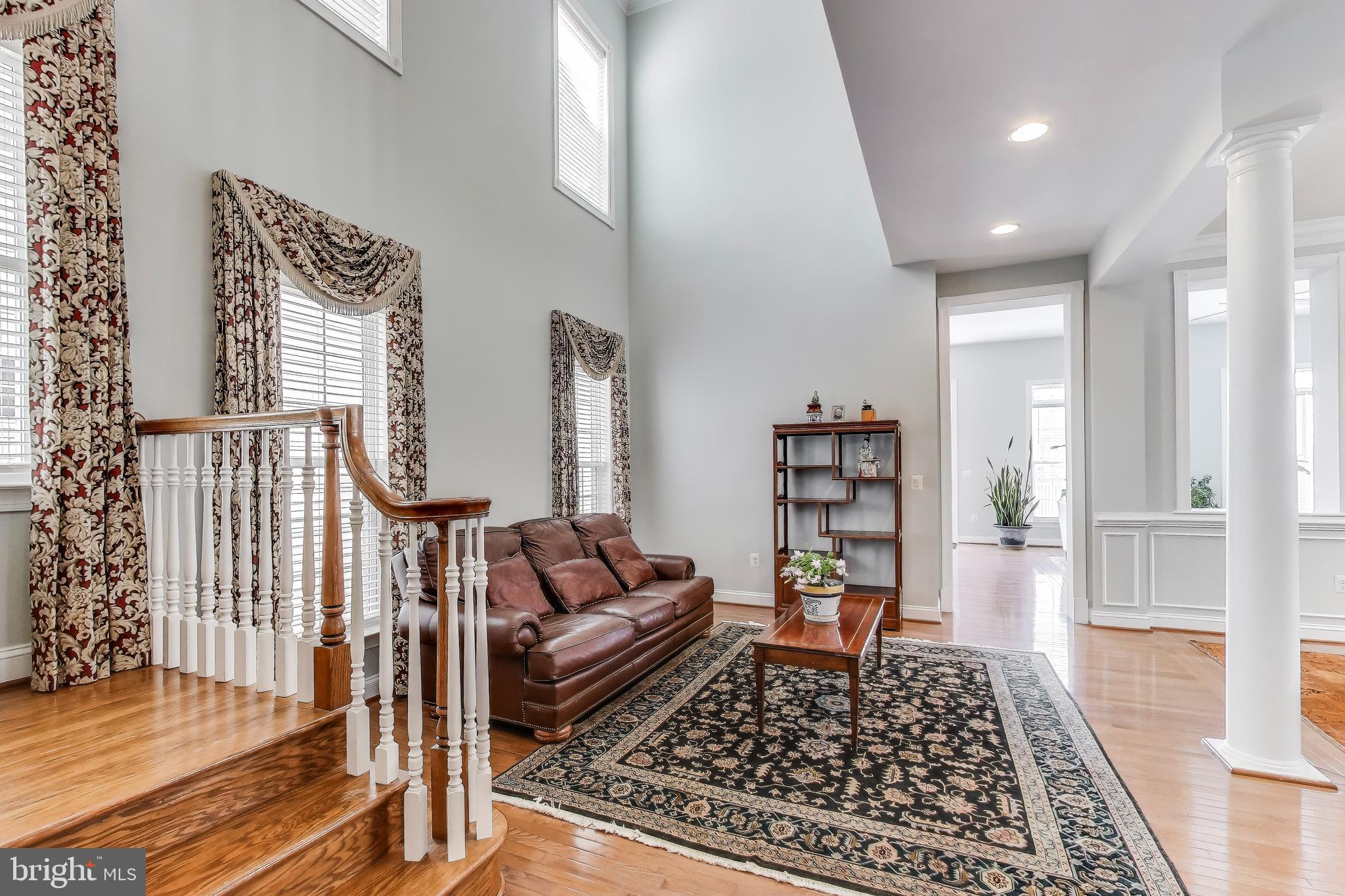 16180 Radburn Street Woodbridge, VA 22191 - Photo 5 of 54 a living room with furniture and a rug