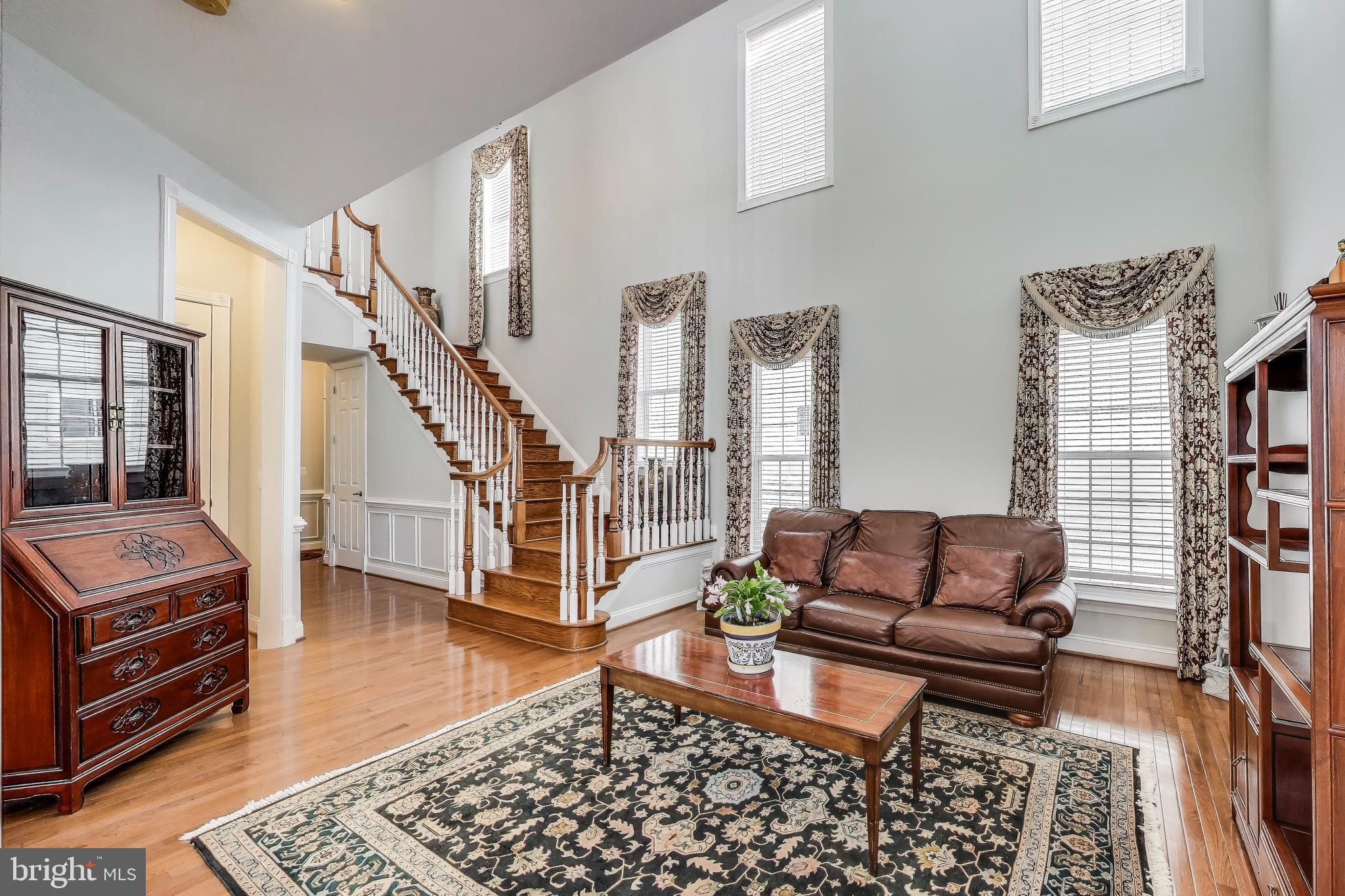 16180 Radburn Street Woodbridge, VA 22191 - Photo 6 of 54 a living room with furniture and a rug