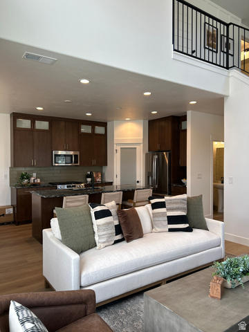 2011 West 1150 South, Unit 1042 Payson, UT 84651 - Photo 22 of 39 Photos are of model home.Open-concept living space featuring a spacious kitchen with dark wood cabinetry and integrated stainless steel appliances