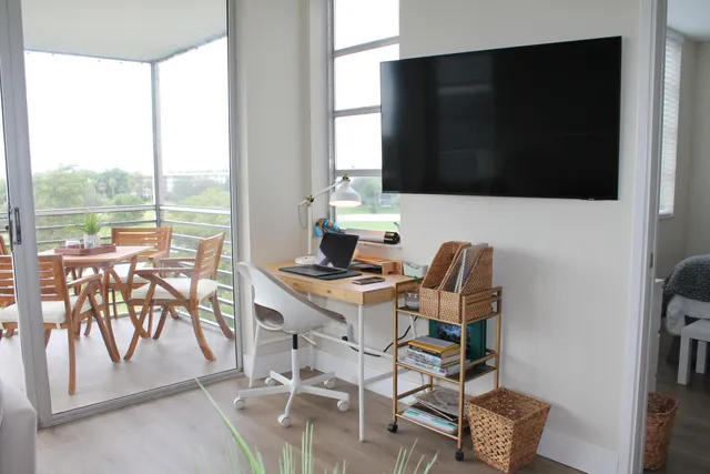 a view of a dining room with furniture window and outside view