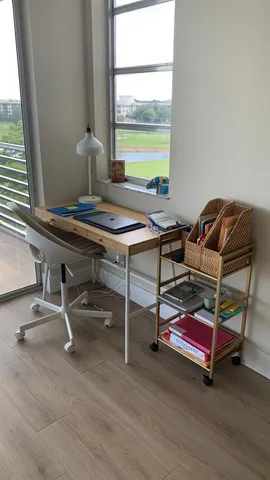 a room with pool table and windows