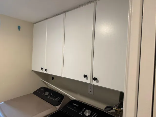 a bedroom with two beds and a fireplace