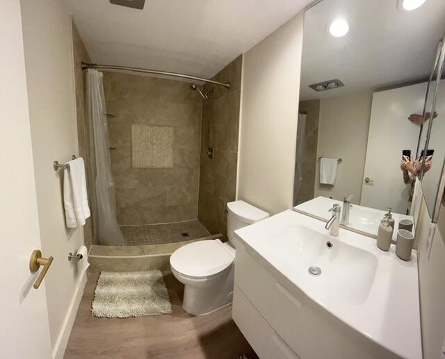3520 Oaks Way, Unit 607 Pompano Beach, FL 33069 - Photo 19 of 46 a bathroom with a sink toilet and shower