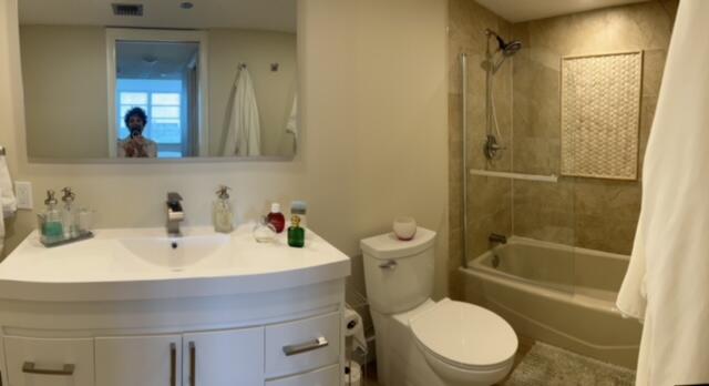 3520 Oaks Way, Unit 607 Pompano Beach, FL 33069 - Photo 25 of 46 a bathroom with a sink toilet and shower
