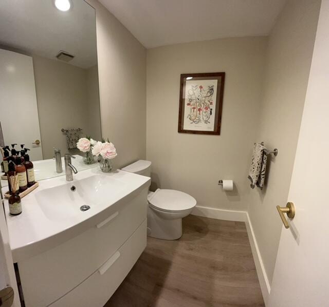 3520 Oaks Way, Unit 607 Pompano Beach, FL 33069 - Photo 29 of 46 a bathroom with a sink mirror and toilet