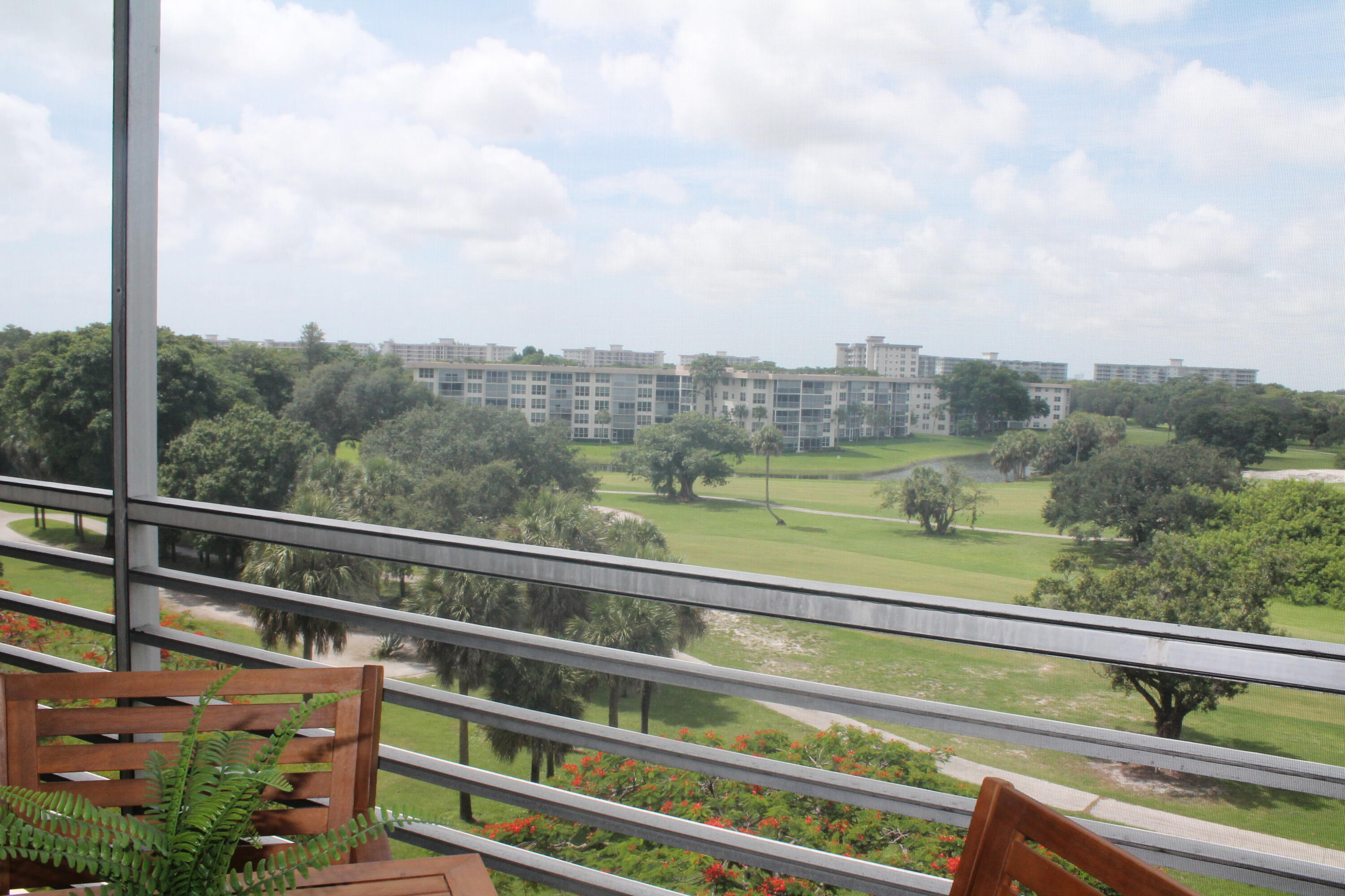 3520 Oaks Way, Unit 607 Pompano Beach, FL 33069 - Photo 34 of 46 a view of a balcony with city view