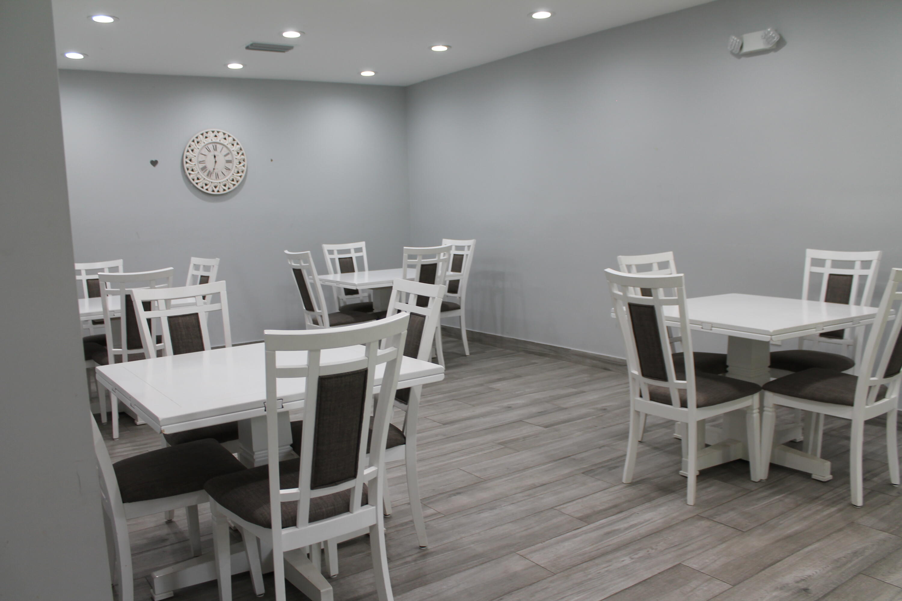 3520 Oaks Way, Unit 607 Pompano Beach, FL 33069 - Photo 41 of 46 a view of a dining room with furniture and wooden floor
